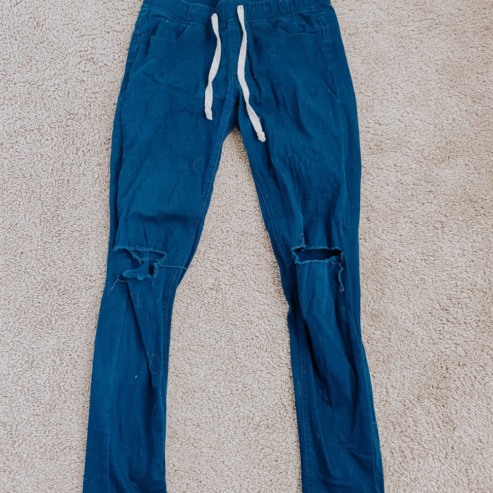 Navy blue pants with holes on knees